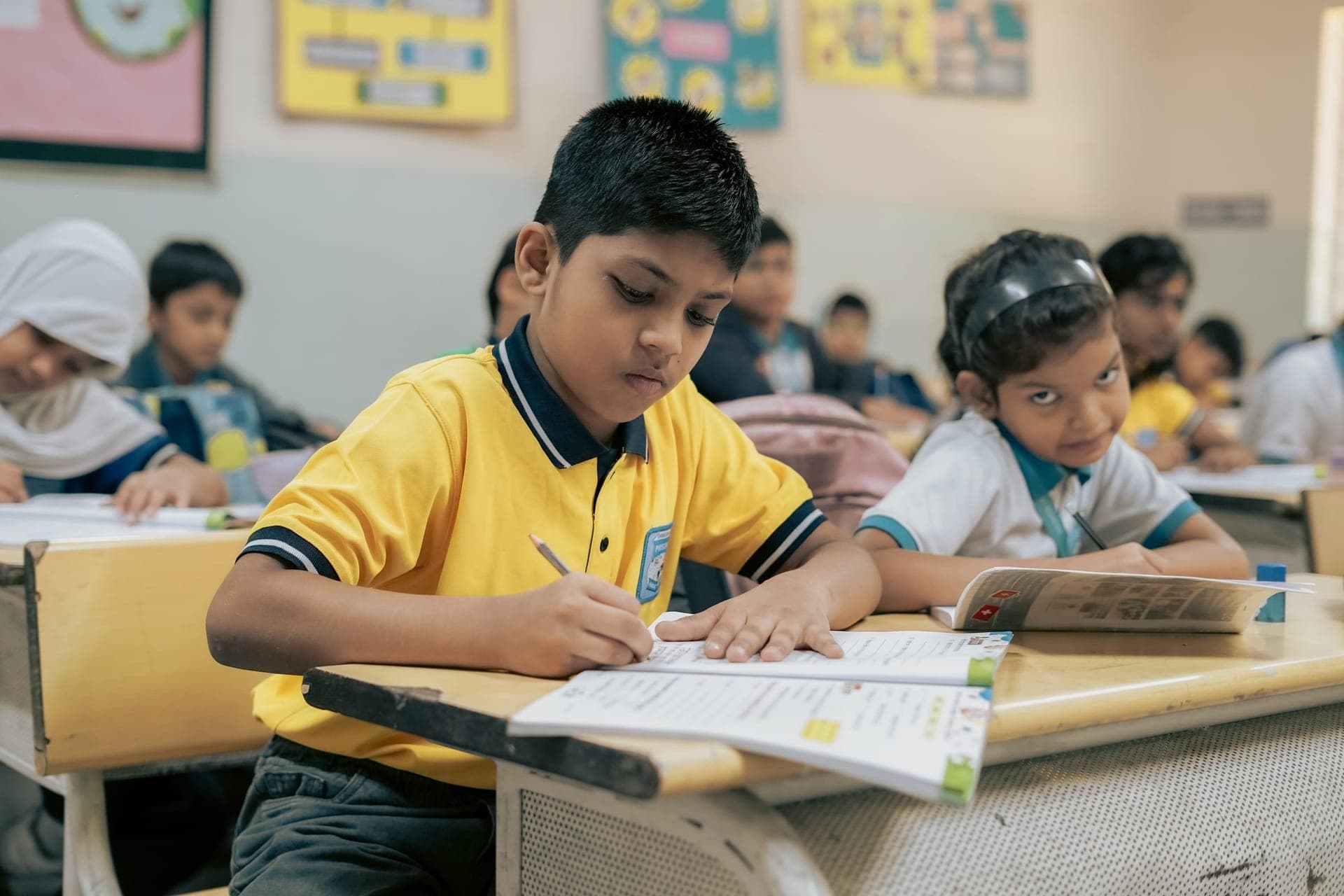 Lower-primary students working at their desks